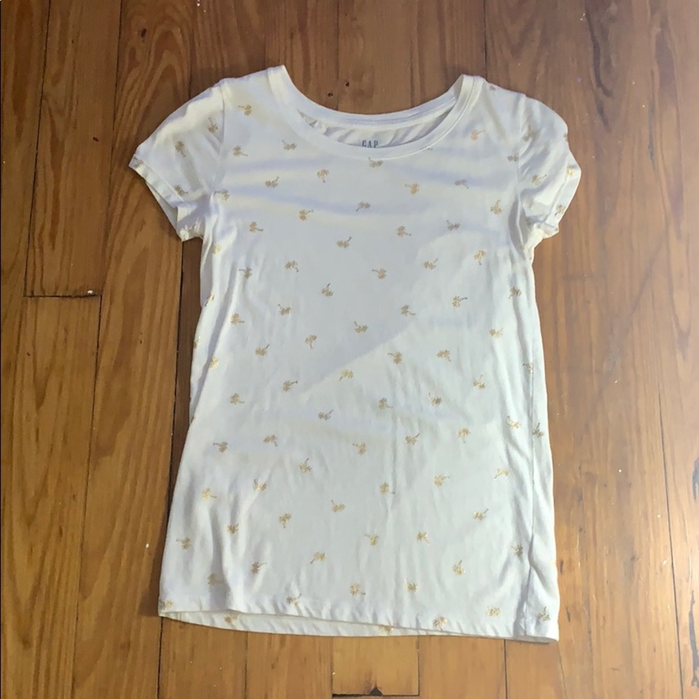 white shirt with gold palm trees